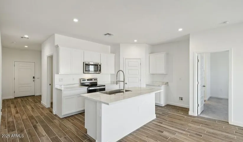 Photos are of a spec and may vary in color, interior selections and design