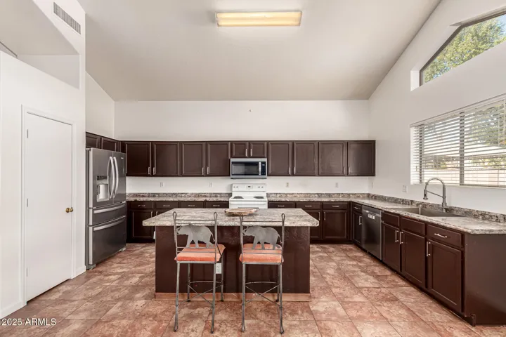 Large kitchen with breakfast bar.