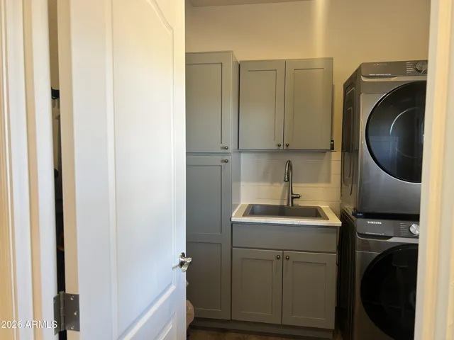 Laundry room with utility sink and plenty of storage
