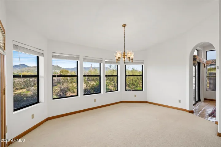 Dining area is part of the living room and easy access to kitchen and the patios outside.