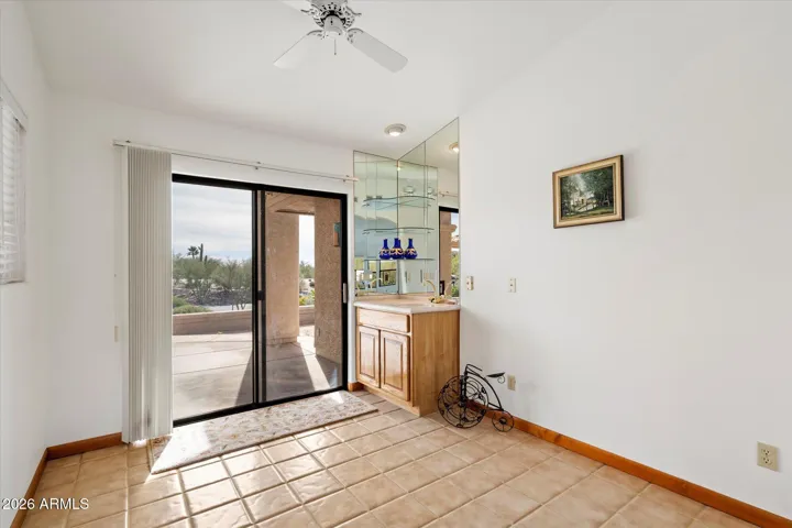 Nice den with wet bar and access to a great patio facing South-west for amazing sunsets and some city lights.