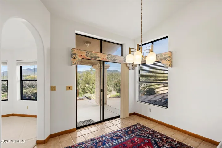 Eat-in kitchen has access to the back atio as well as right across the hall from ther garage.