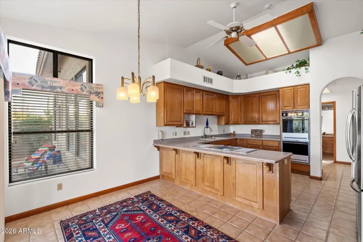 Lots of natural light with skylight , windows and door to