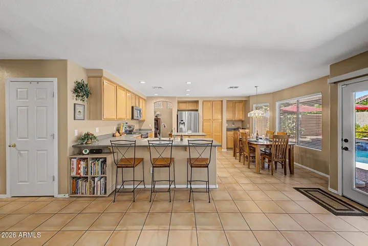 Family room and Breakfast Bar with Door to BackYard