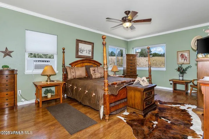 Bedroom with upgraded flooring and windows, plenty of space to relax and unwind.