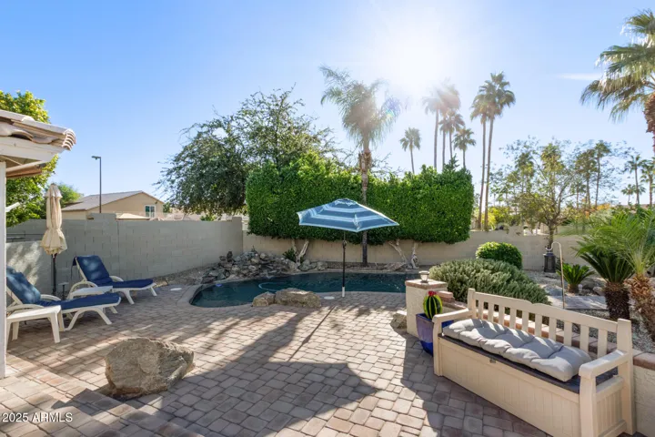 Beautiful pavers all around the pool , decking and area leading to lake