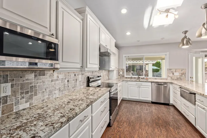 Elegant Quartz counters & Cabinetry, Stainless Appliances + abundant Storage