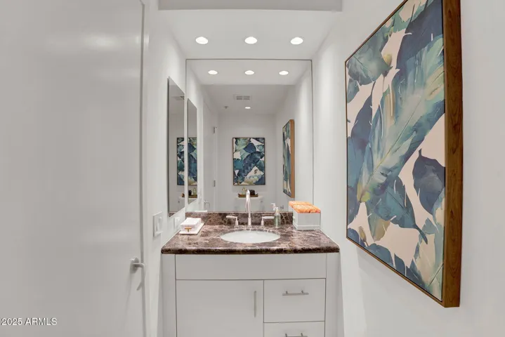 A convenient powder room located just off the living area.