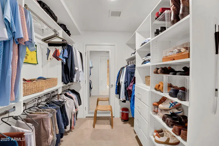 The primary suite features two separate walk in closets with ample storage space