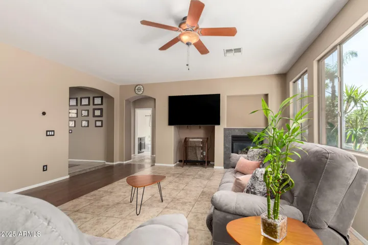 Family room with gas fireplace and views of back yard.