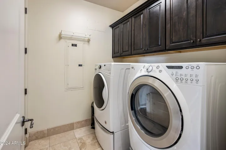 Laundry room, washer and dryer stay with the unit