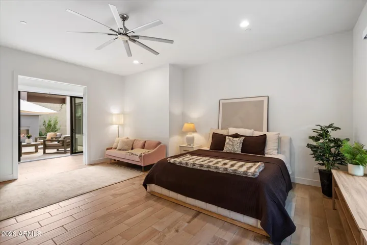 Bright bonus room with wood-look tile flooring and neutral finishes. Perfect as a second primary, media room, home office, fitness space, or flex living area in this Scottsdale home.