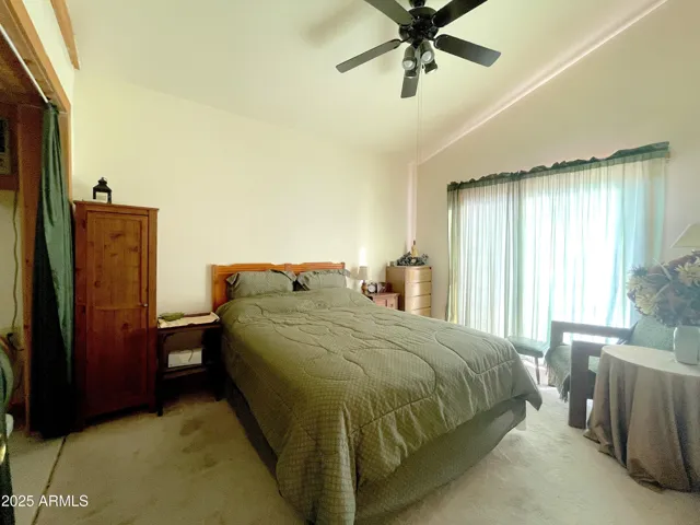 Second bedroom downstairs has a large closet and sliders to the outside.