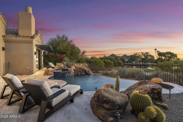 A true golf-resort lifestyle in your own backyard, framed by legendary fairways, reflective water, and iconic mountain views.