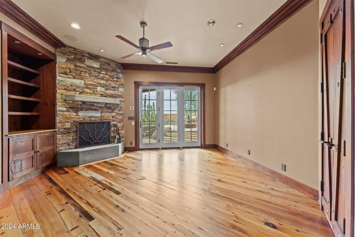 Accented with a Stone Fireplace and Crown Molding