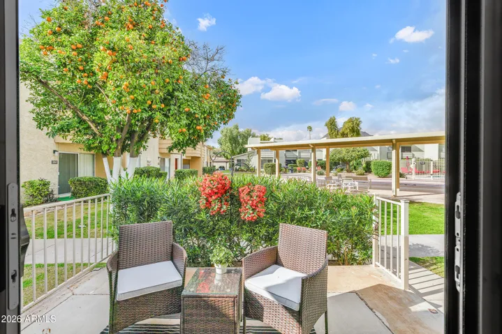 Back patio/sitting area steps away from community pool/shuffleboard area
