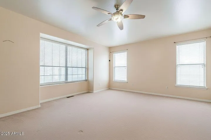 This room is just off the main entrance to the home. It is a huge room and will work great as an office. This photo is virtually rendered using AI.