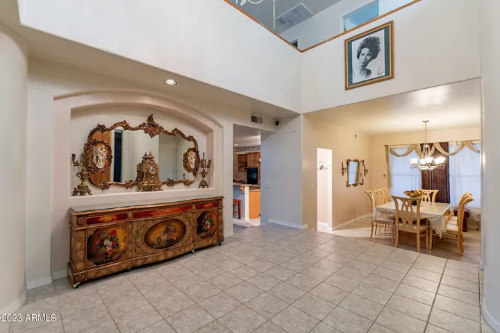 Grand foyer with access to garage, dining room and flexible room (bedroom, office, movie room, game room)