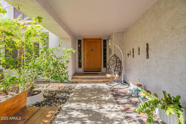 This corner lot allows for a wrap around front yard with mature fruit trees and covered walkway to the front door.