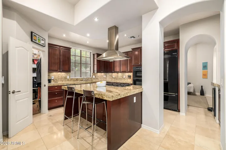 Features include professional grade gas range & integrated wall oven.
