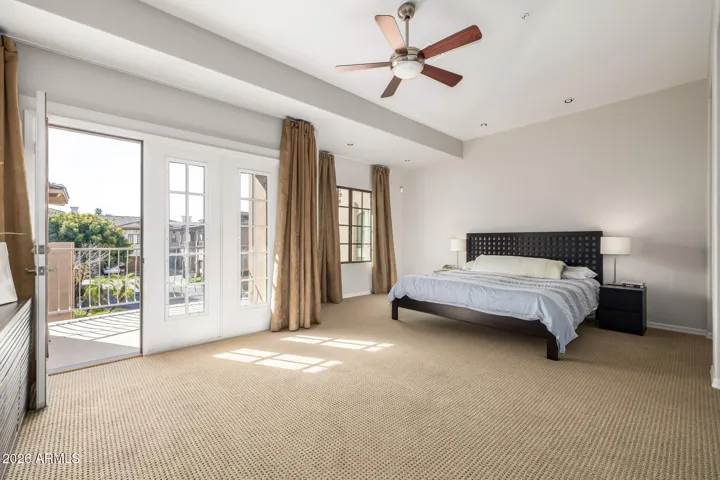 A true escape featuring elegant French doors that open to two private balconies.