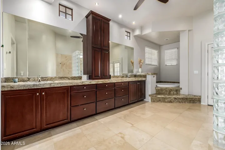 Offers an enormous dual vanity & deep soaking tub.