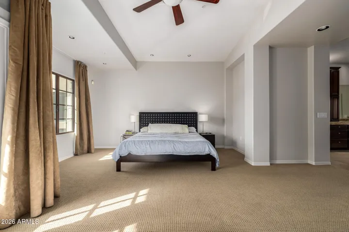 Featuring elegant French doors that open to one of two private balconies.