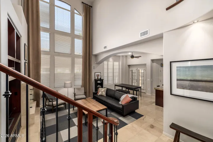 A sweeping grand staircase anchors the grand entryway.