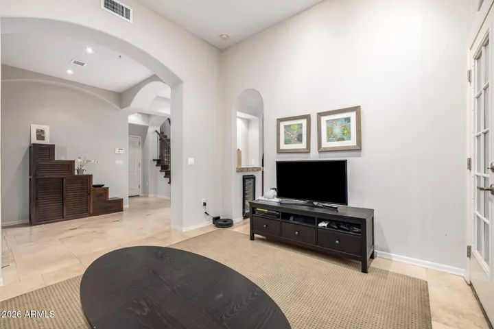 Foyer leads to a grand entryway.