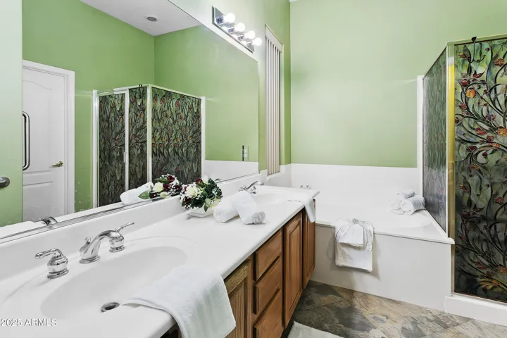 Master with dual sinks and seperate tub and shower not stained glass on shower...just paper now removed.