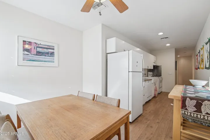 2 bed dining area and view towards kitchen