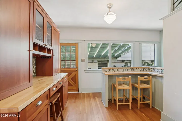 Breakfast bar, door to spa and steps to the basement