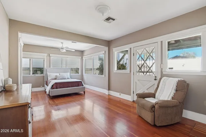 Door in primary bedroom out to the spa and backyard