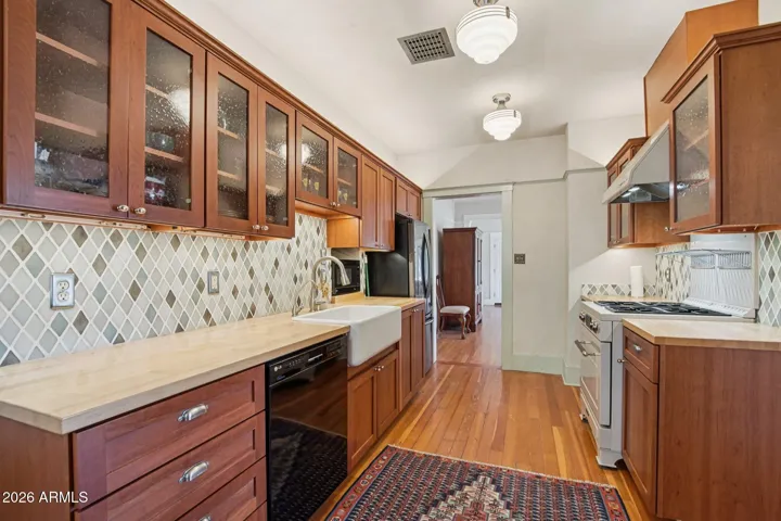 Updated Rejuvenation lighting, wood flooring throughout.