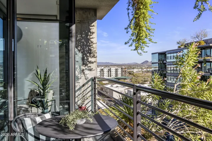 Largest 1-bedroom + den in Optima Kierland 7120. This 9th floor original 2-bedroom unit floorplan is reimagined to expansive updated 1-bedroom + den executive condo. Sub-Zero, Miele, Bosch appliances, Wine Fridge, Wine Wall, Bar, 3-way Fireplace, NE Mountain and Courtyard Views.