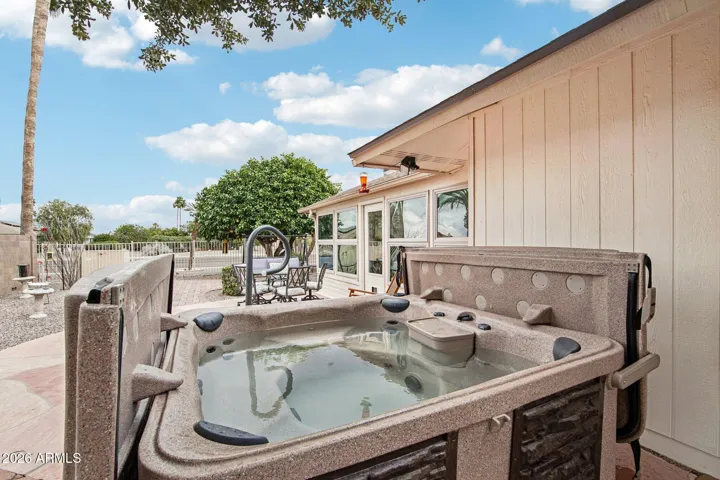 The back paver patio and hottub.