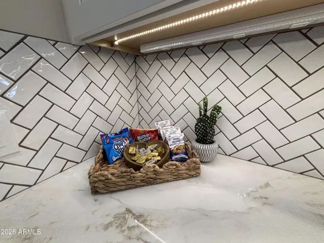 Convenient charging and USB ports under cabinets in kitchen.