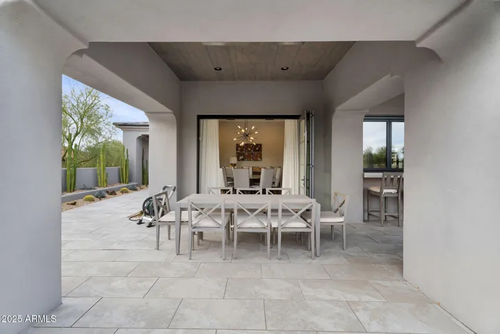 Outdoor dining right off the indoor dining room with full pocket doors.