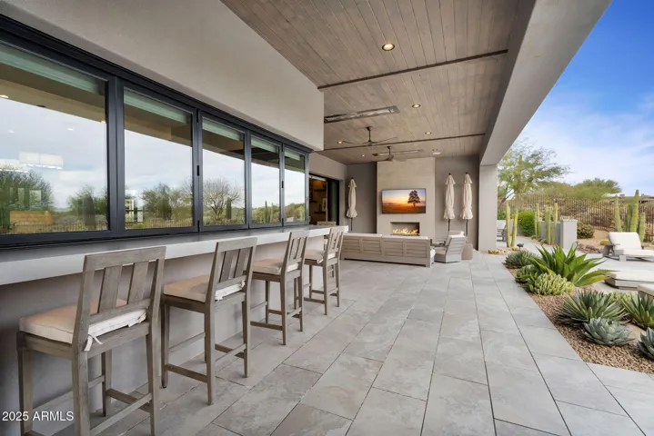 Outdoor seating with pass through windows that fully open to the inside.