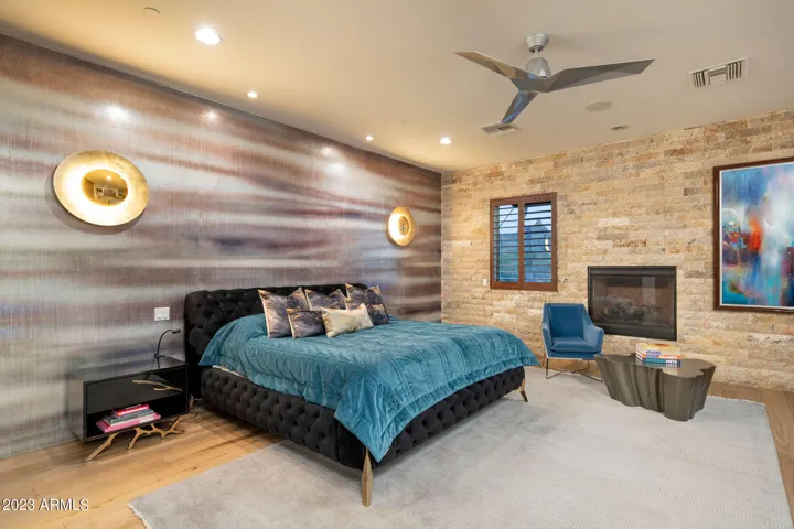 The main-level primary suite is a true retreat with a private patio and quiet separation from the secondary bedrooms.