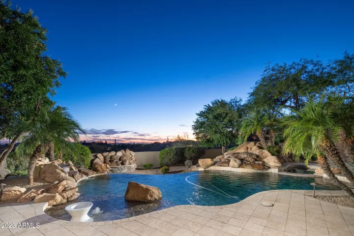 A resort-style pool and spa framed by the quiet beauty of the desert.