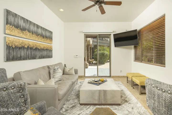 A detached one-bedroom casita is ideal for extended stays, featuring a sitting room, full bath, kitchenette, and a rooftop deck with city-light views.