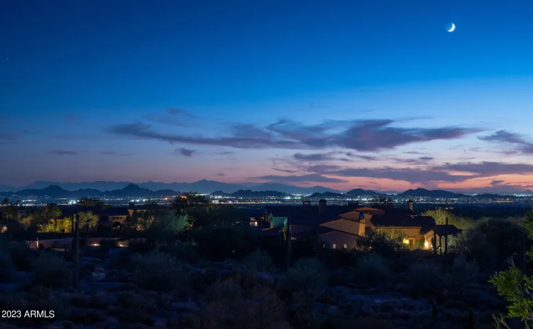 City-light views and desert skies set the tone for elevated living.