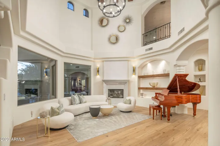 Dramatic ceilings and clerestory windows fill the living space with natural light .