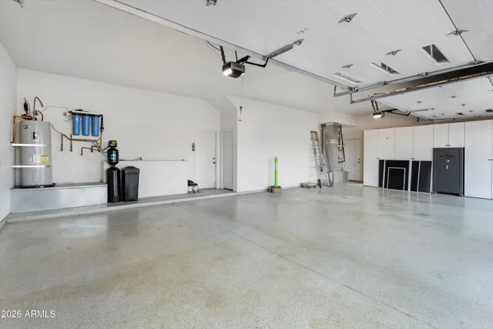 Expansive four-car garage with clean finishes, high ceilings, and room for vehicles, tools, and storage. Ideal for hobbyists, car enthusiasts, or those needing extra workspace.