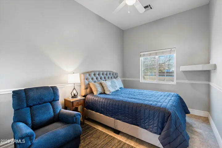Bedroom three features tile flooring, natural light, and a functional layout with closet storage. Ideal for a variety of uses while maintaining consistency with the home’s finishes.