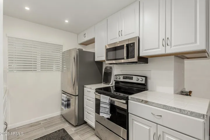 SS Refrigerator, SS electric oven/stove combo, & SS b/i Microwave,