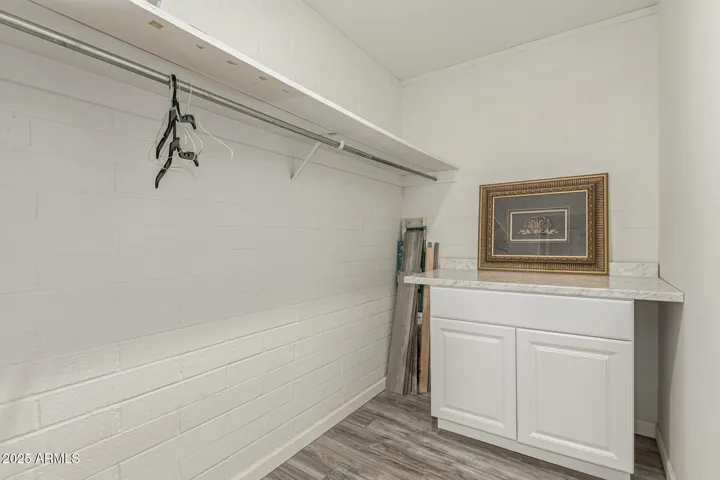 Large Bedroom closet with electric panel, and attic access too