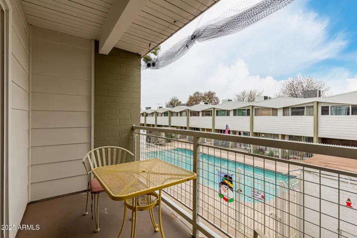 Covered Balcony view of pool pic 1