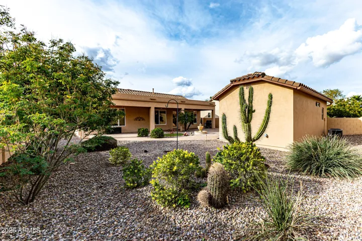 Professionally designed and maintained landscaping. PVC piping put in under ground, you'll be amazed how large this homesite is.